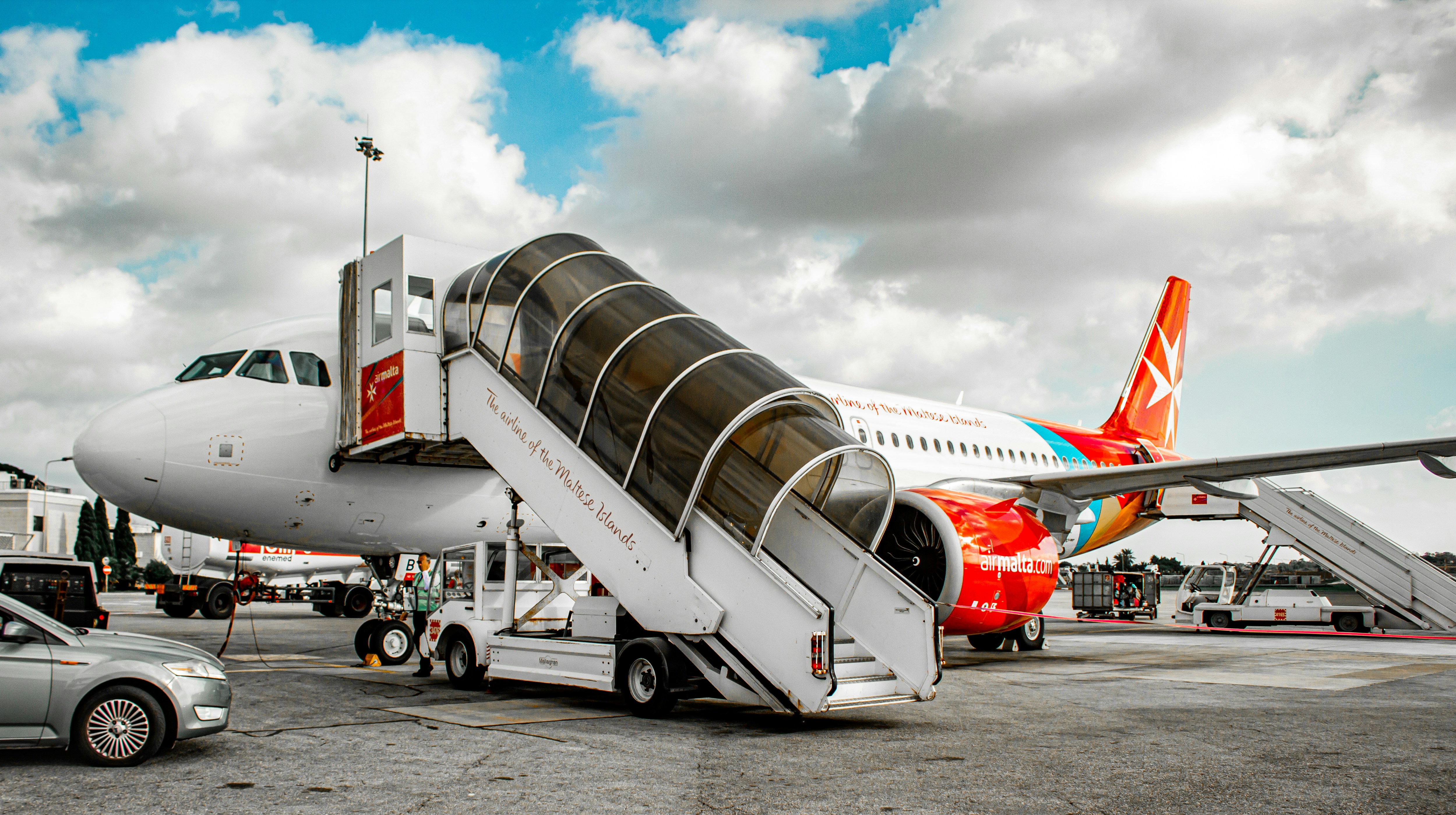 a large jetliner sitting on top of an airport tarmac, 