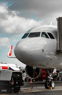 a large jetliner sitting on top of an airport tarmac