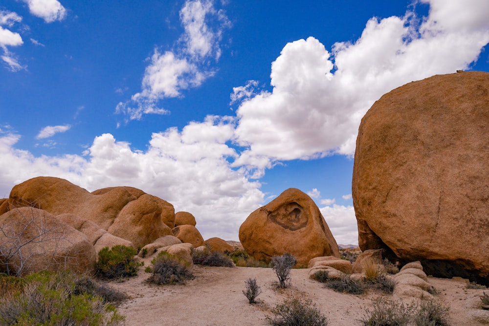 a large rock formation in the middle of a desert