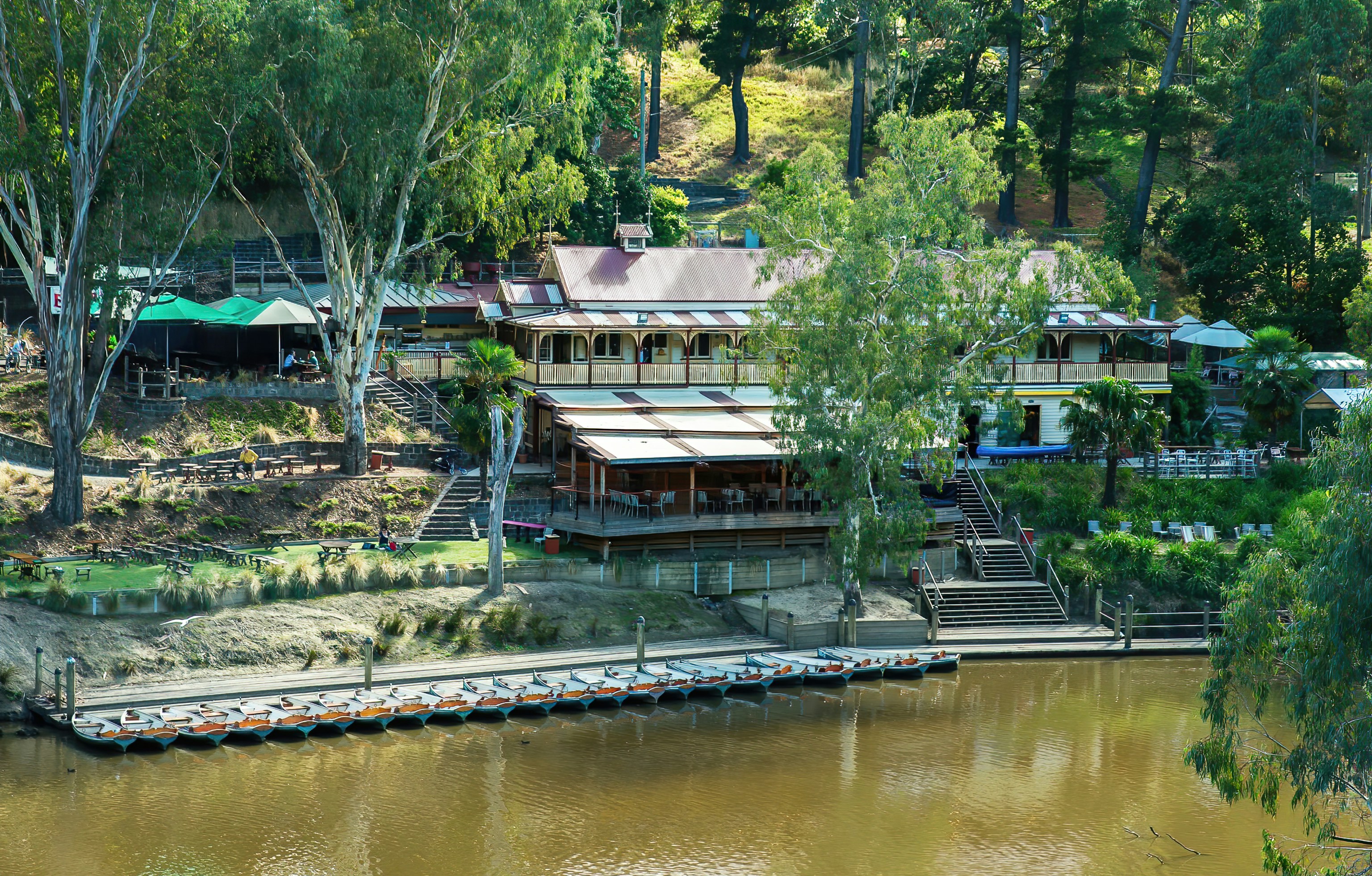 an aerial view of a house on a lake