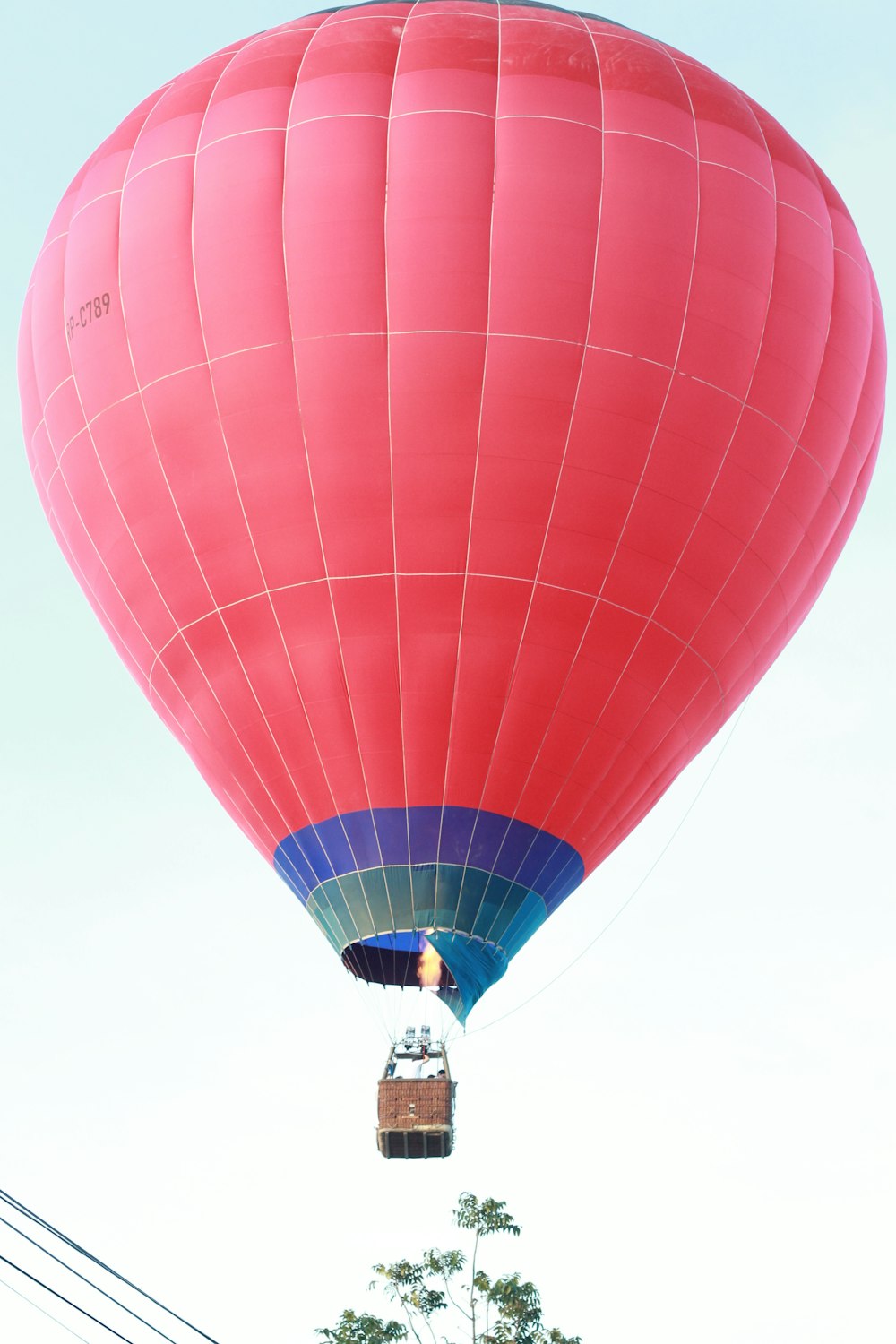 a large hot air balloon flying through a blue sky
