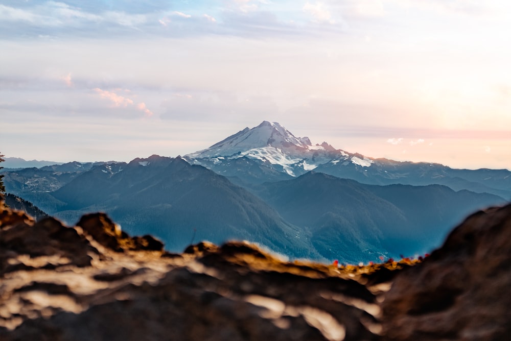 a view of a mountain from a rocky outcropping