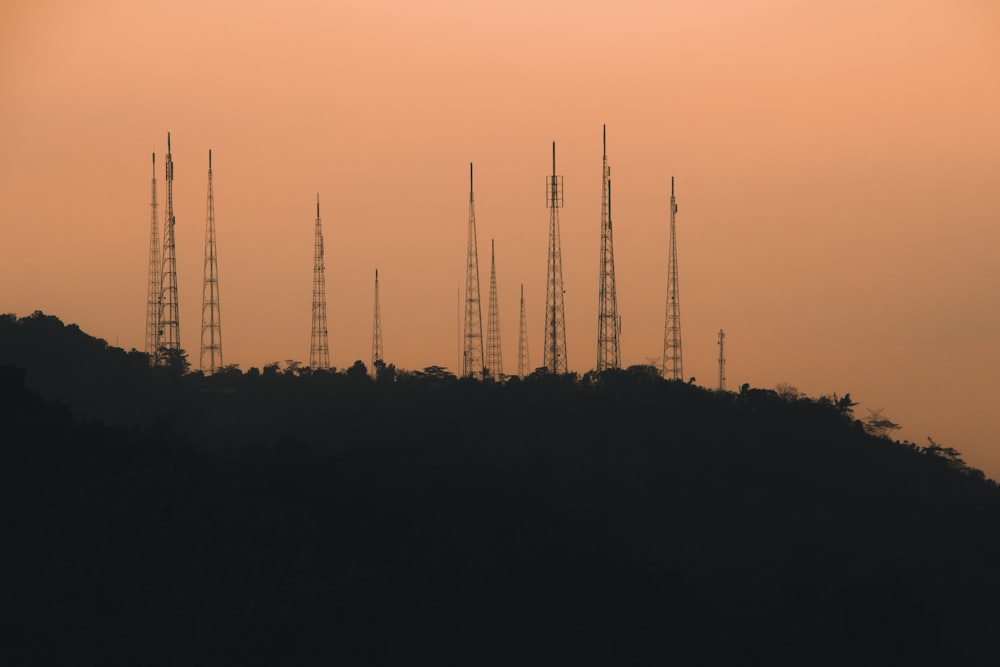 a hill with a lot of cell towers on top of it