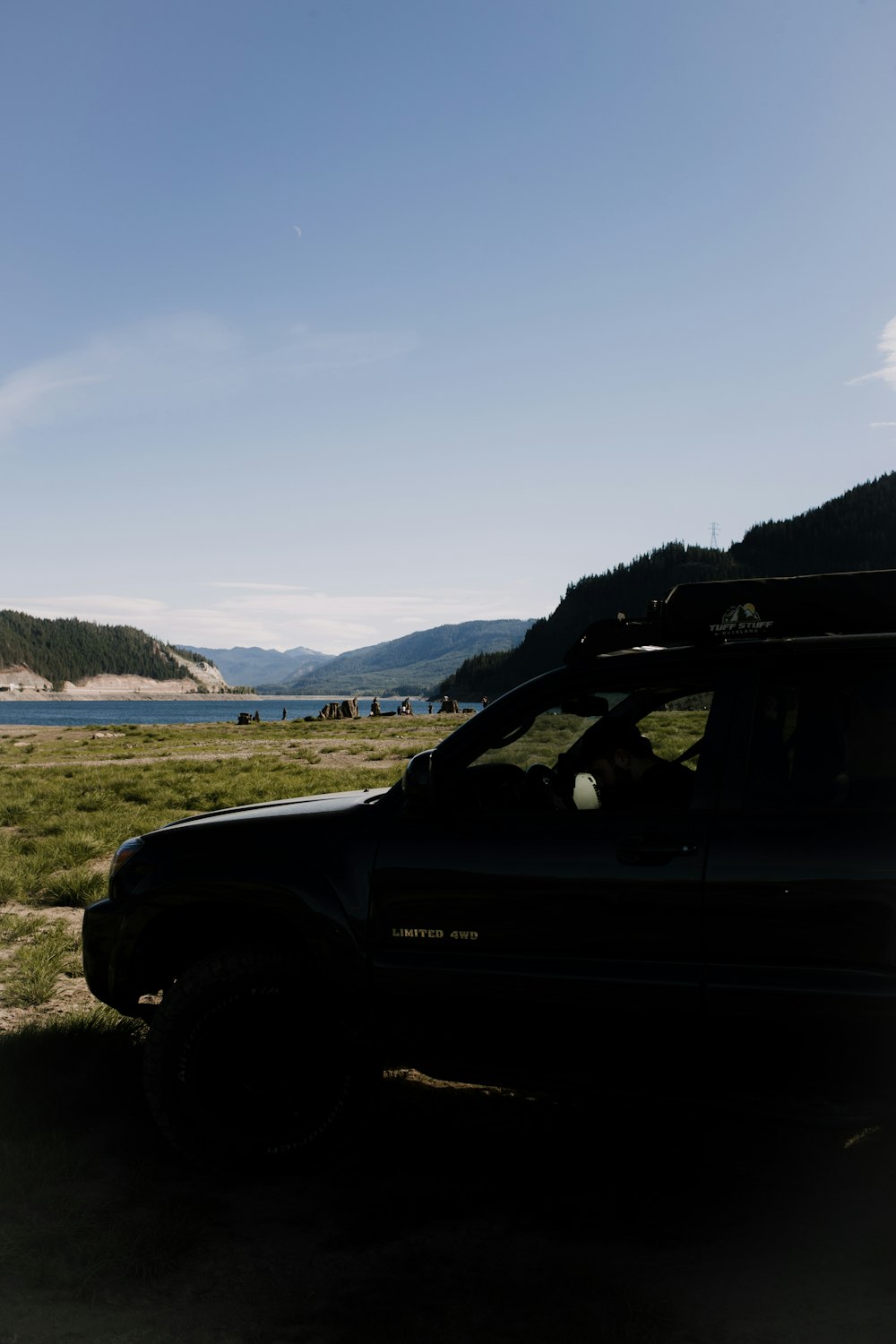 a car parked on the side of a hill