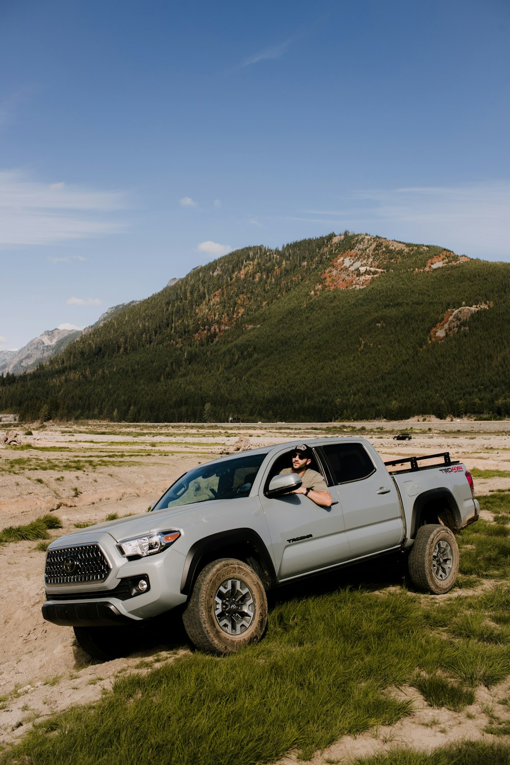 a car parked on the side of a mountain