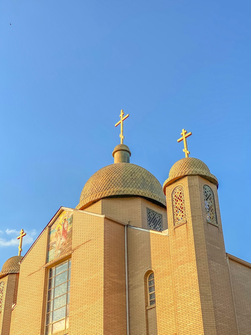 a church with a cross on the top of it