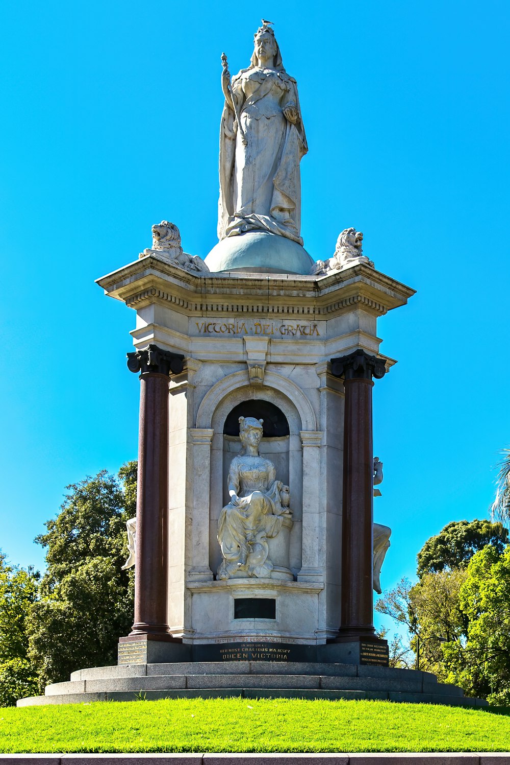 a monument with a statue on top of it