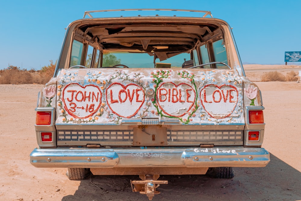 a van with a painted back and the words john love bible love written on it