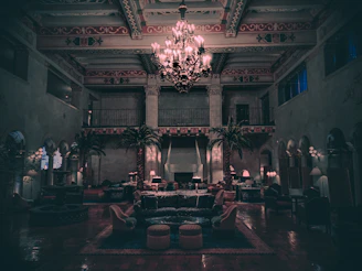 Softly lit image of a serene, luxurious lounge with plush seating and delicate floral accents.