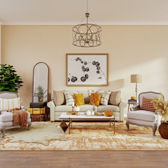 Cozy living room decorated with autumn leaves and warm-toned pillows.