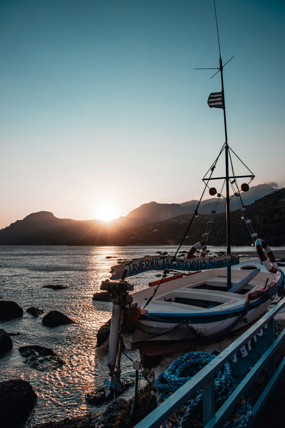 a row of boats sitting on top of a body of water