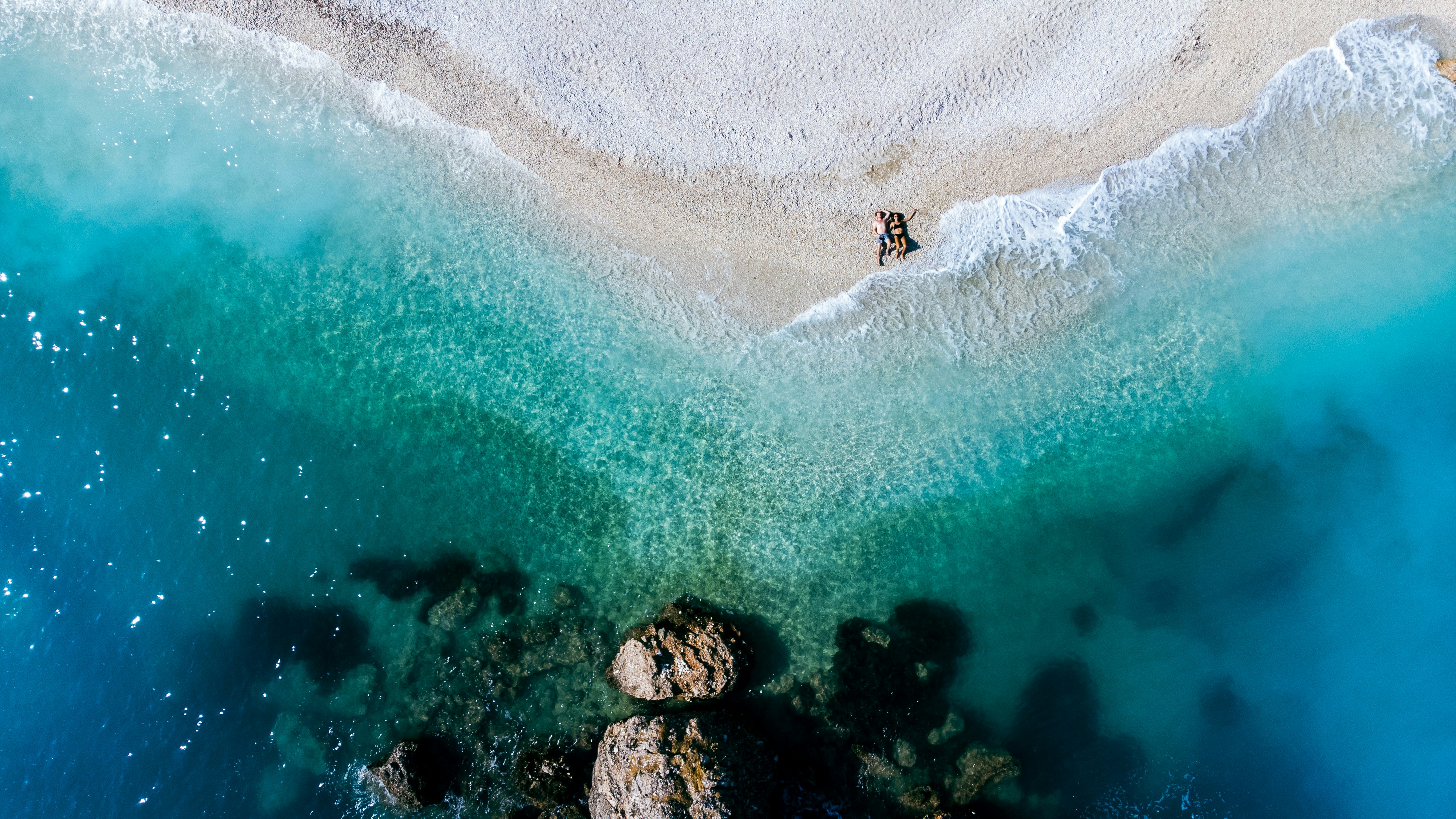 an aerial view of a beach and a body of water