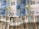 Several banknotes arranged in a slightly disorganized manner. The upper part displays four 20 Euro notes with a blue and yellow color scheme, featuring European architecture motifs. Below them, multiple 20 US dollar bills with green and white tones are visible, showing images of the White House.