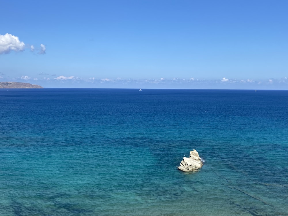 a large body of water sitting next to a beach