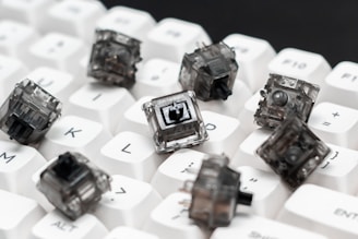 a close up of a keyboard with a bunch of small objects on it
