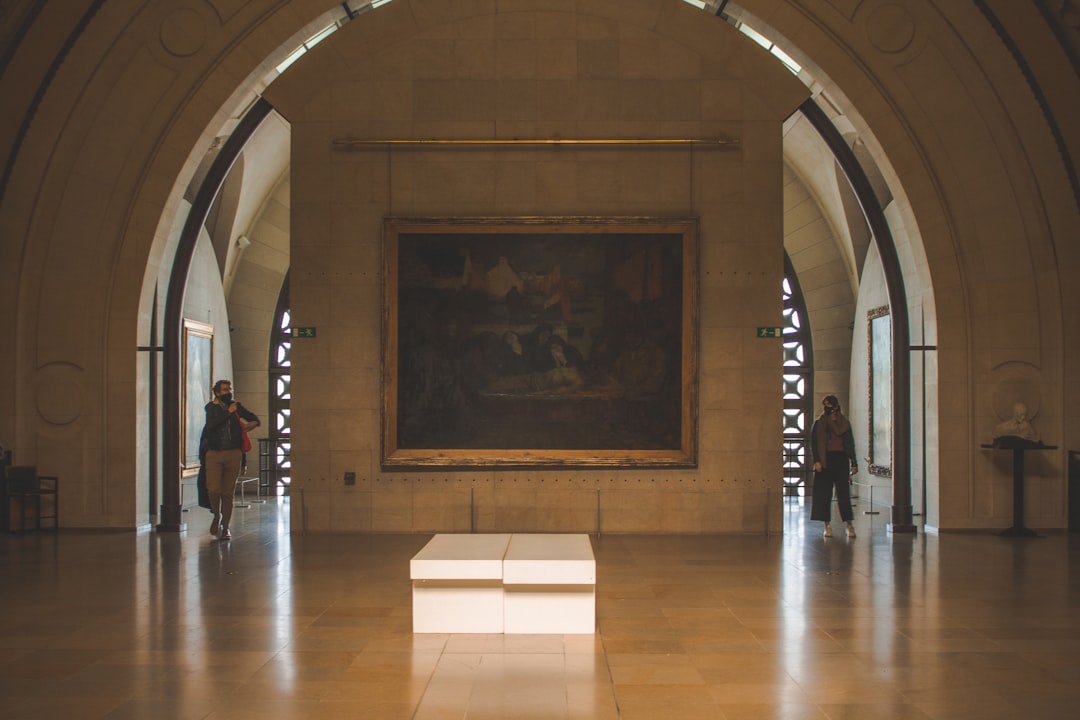 a large painting hanging in a large room,