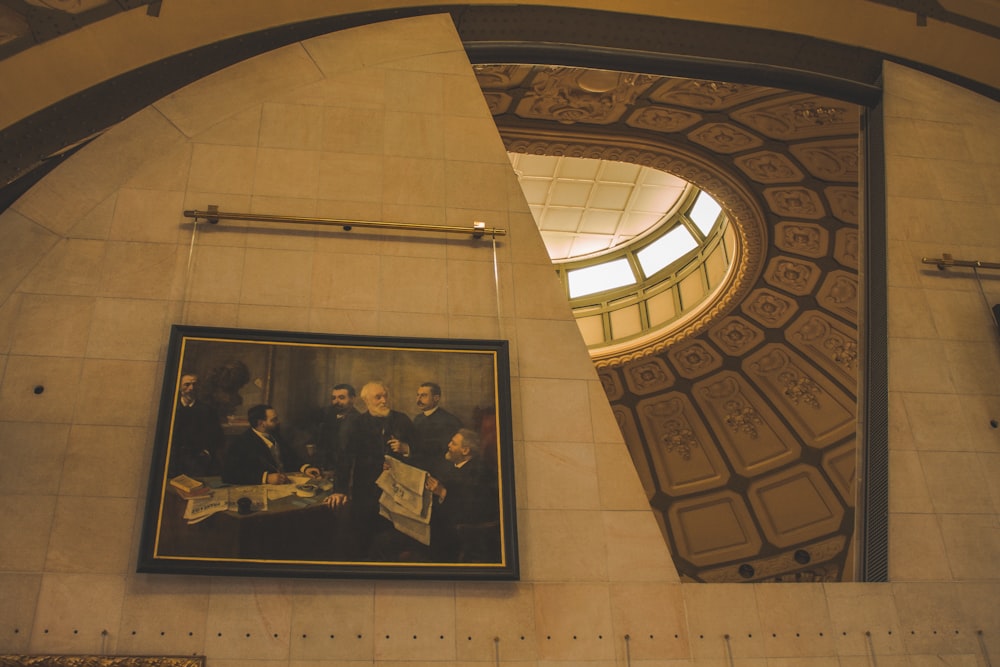 a picture of a group of people hanging on a wall