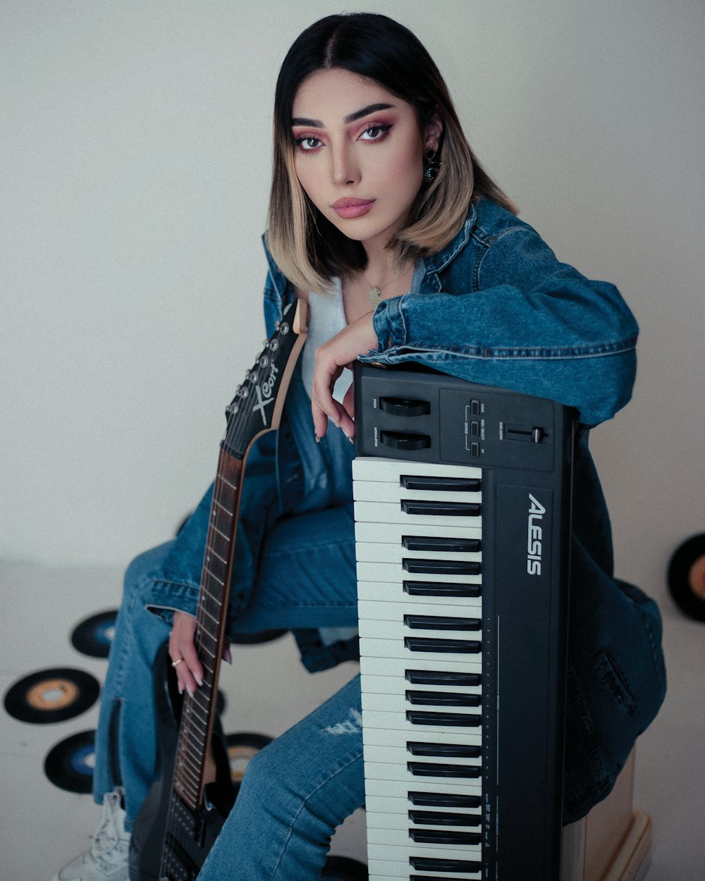 a woman sitting on top of a piano