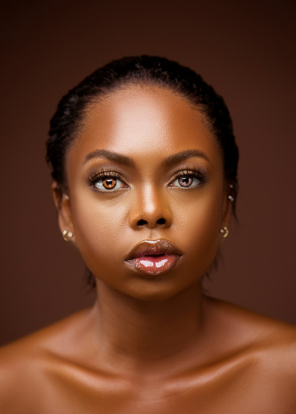 an african american woman with a brown background