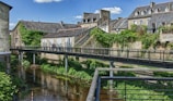 a bridge over a river in a small town