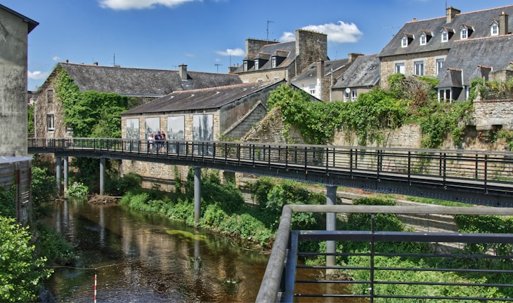 a bridge over a river in a small town
