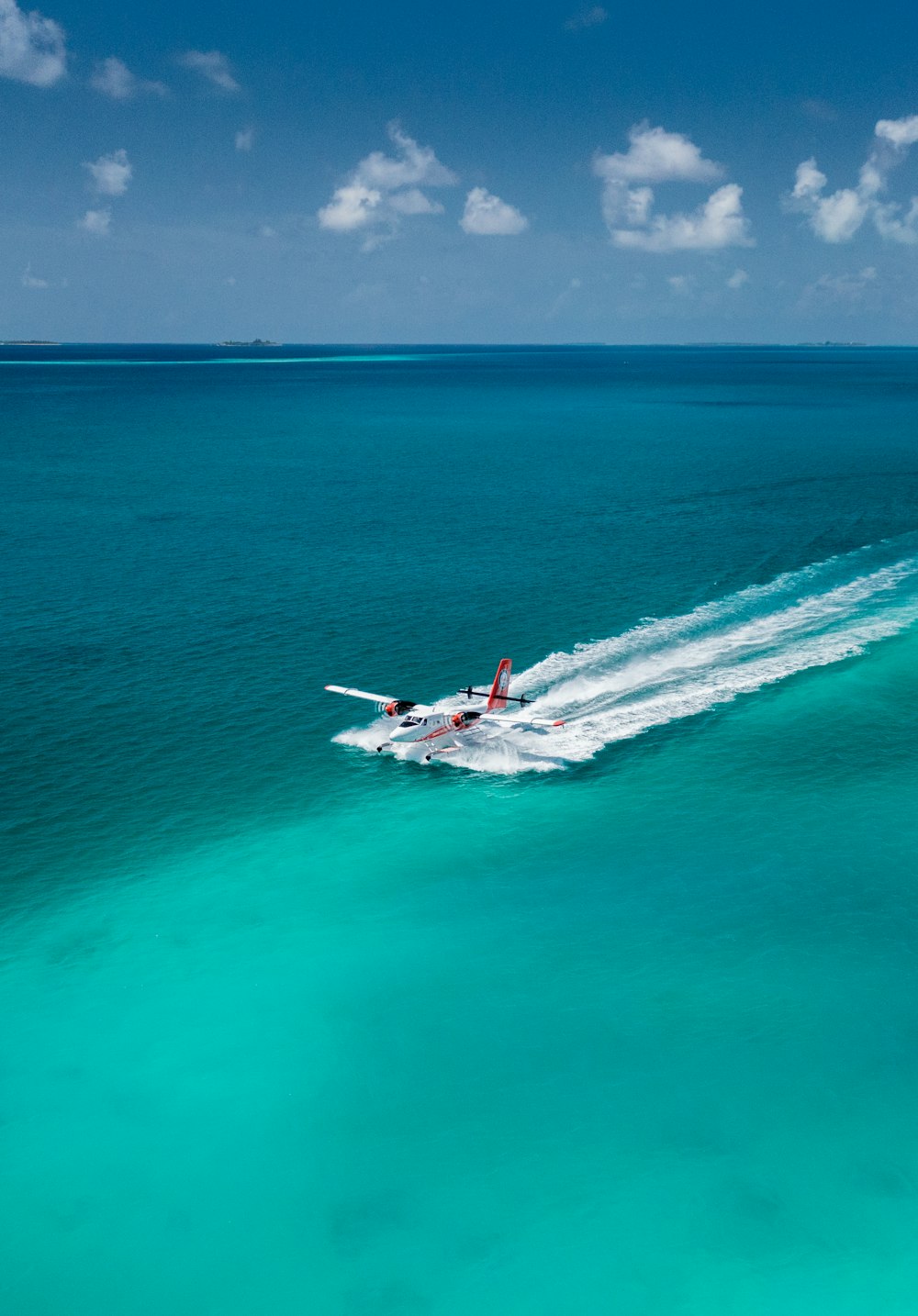 a plane flying over a body of water