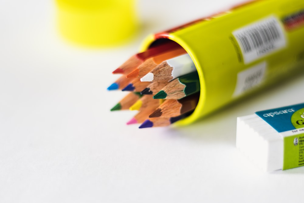 a group of pencils sitting next to each other