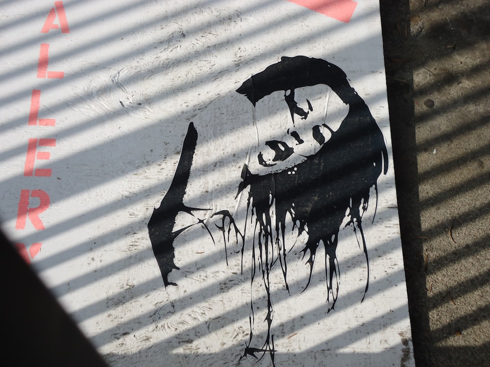 a graffiti of a man holding an umbrella