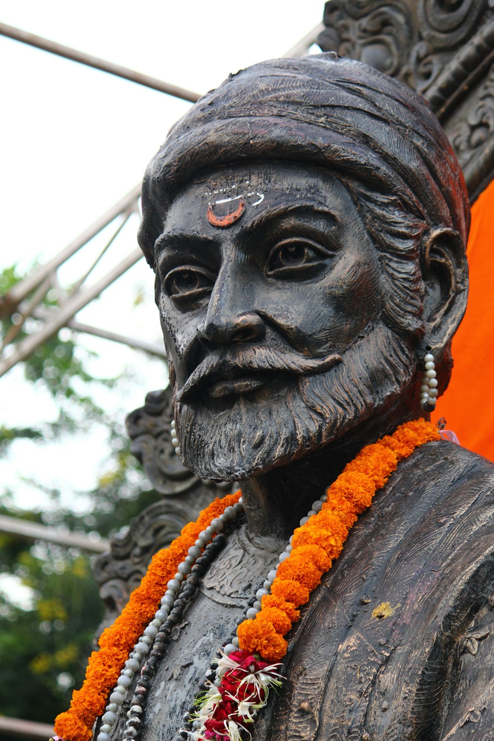 a close up of a statue of a man with a beard