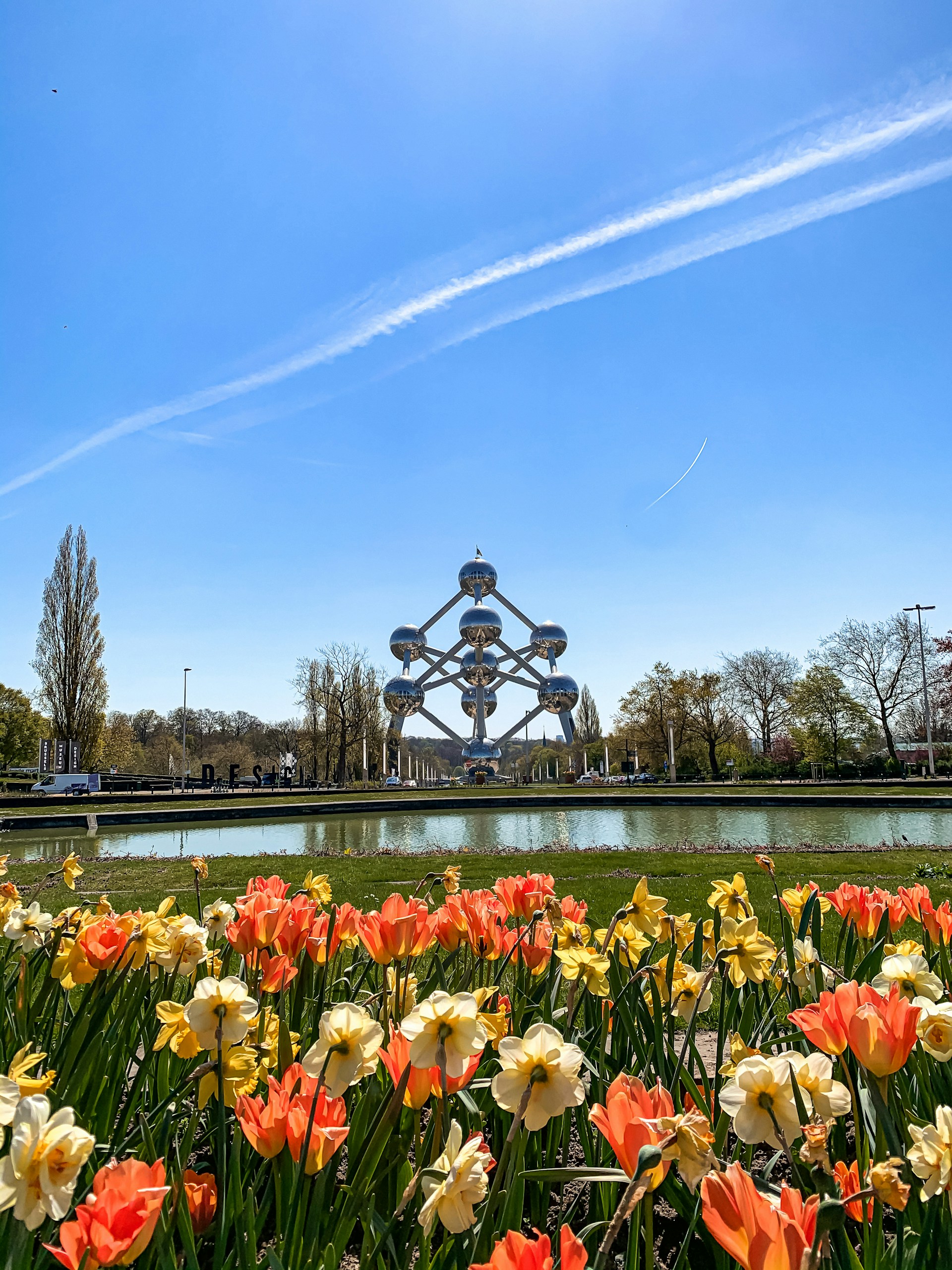 a statue of a person surrounded by flowers