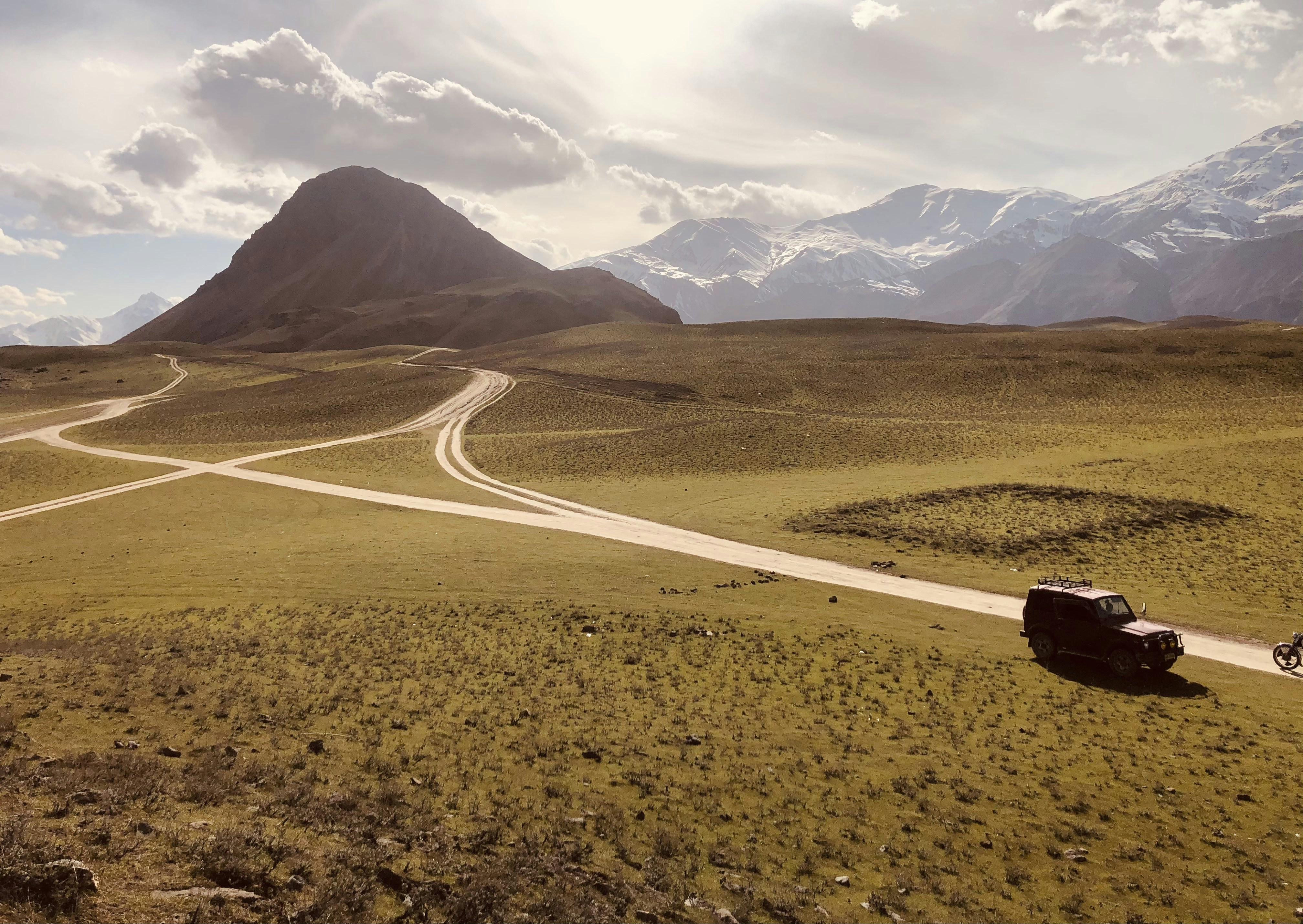 David Ellison's Skydance and the Road to Warner Bros. Discovery — a truck driving down a dirt road next to a mountain