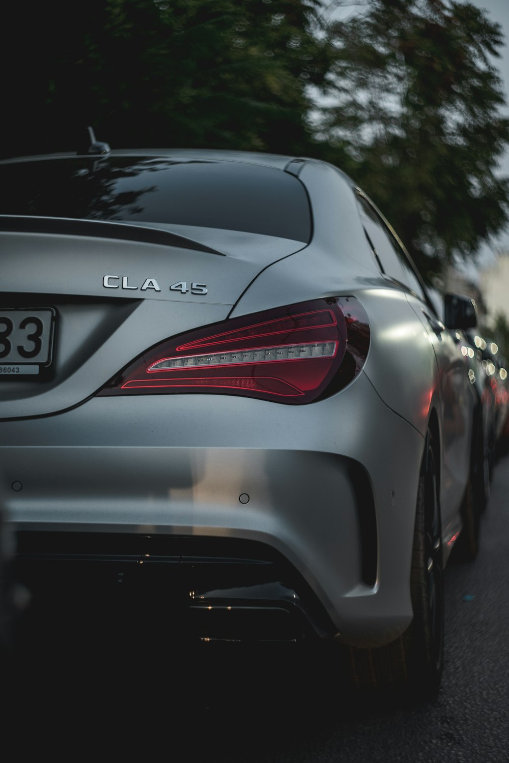 a close up of a car parked on the side of the road