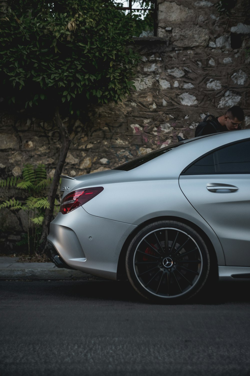 a silver car parked on the side of the road