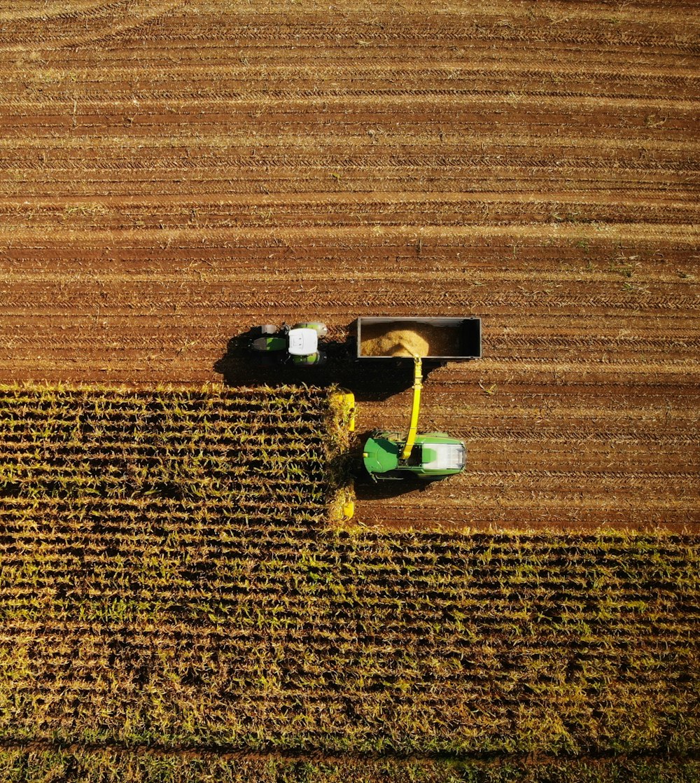 an aerial view of a farmer's tractor in a field