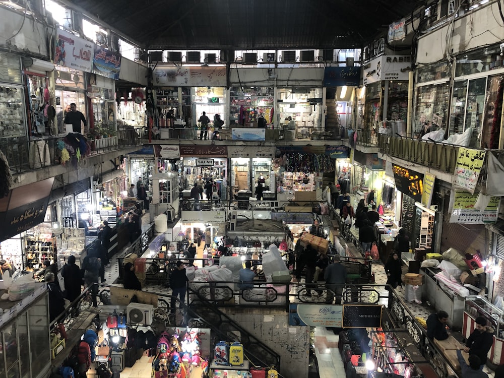 a crowded shopping mall filled with lots of people