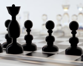 a close up of a chess board with pieces on it