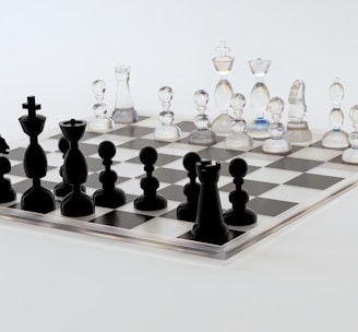 a glass chess board with black pieces on it