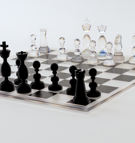 a glass chess board with black pieces on it