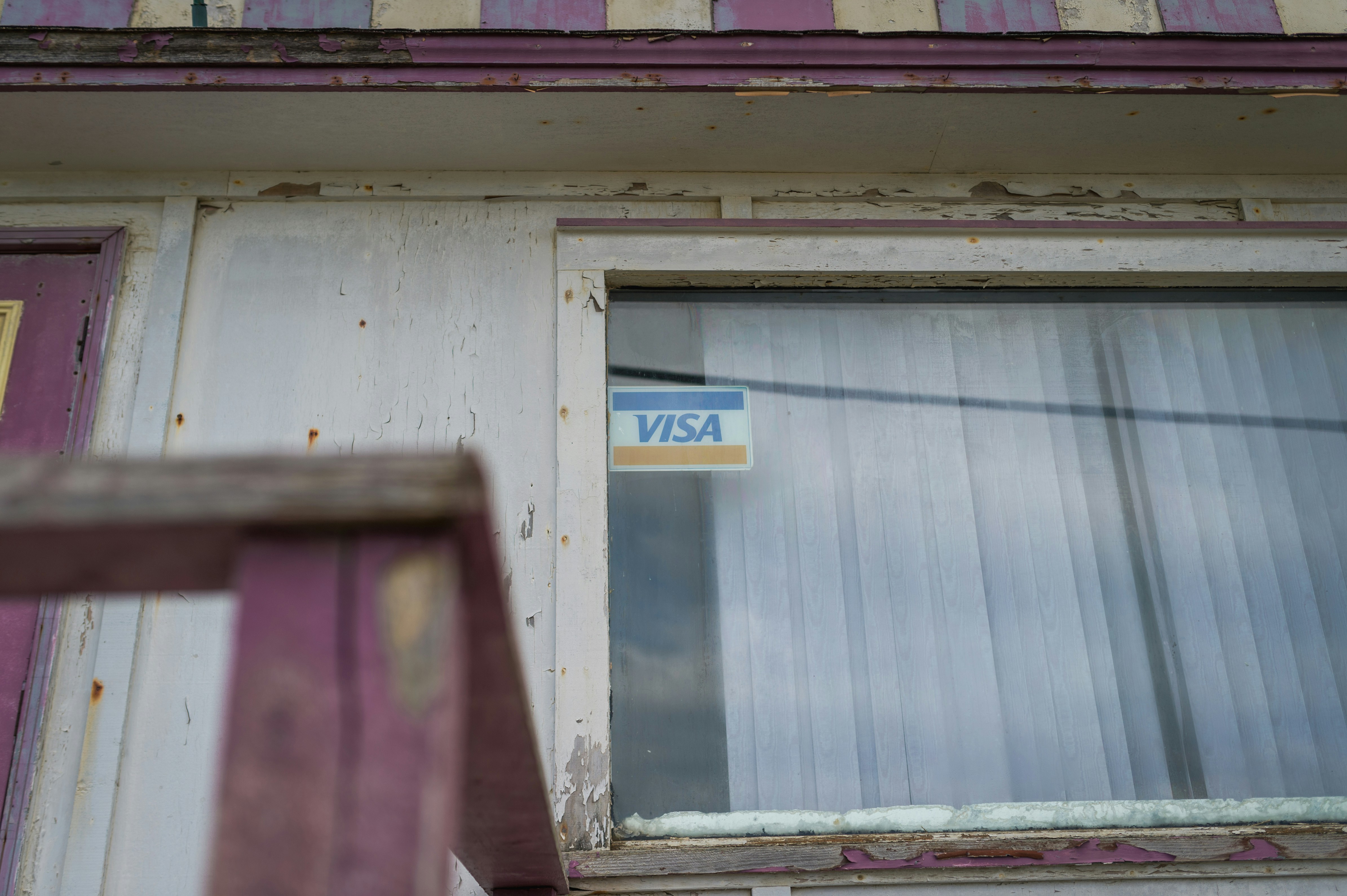 a window with a sticker on the side of it
