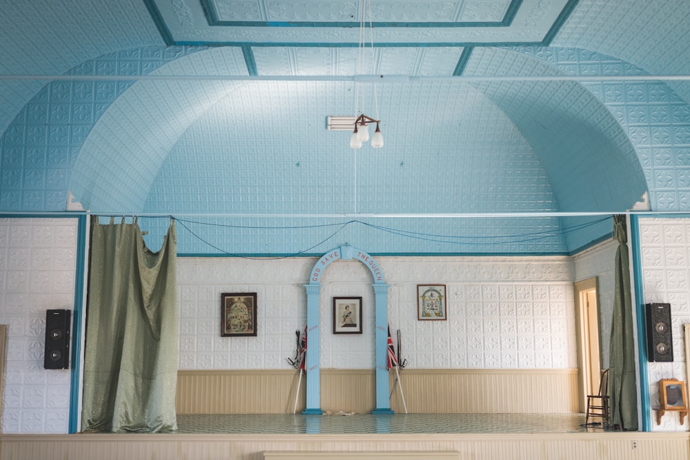 a blue and white room with a blue ceiling