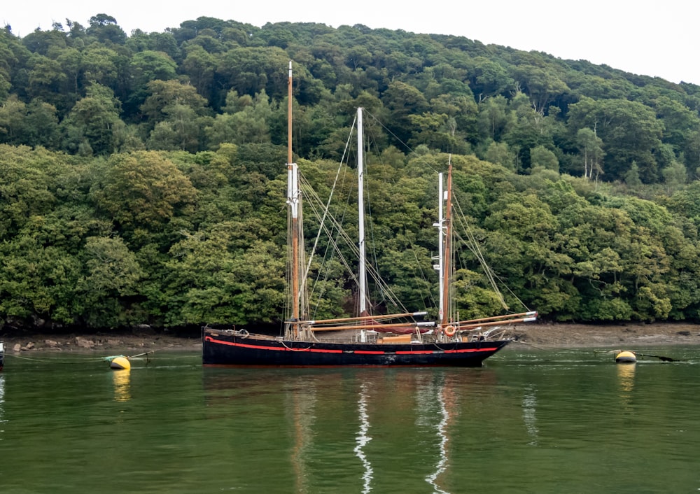 a large boat floating on top of a body of water