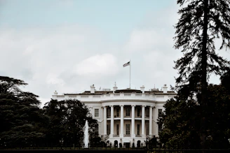 a white house with a flag on top of it