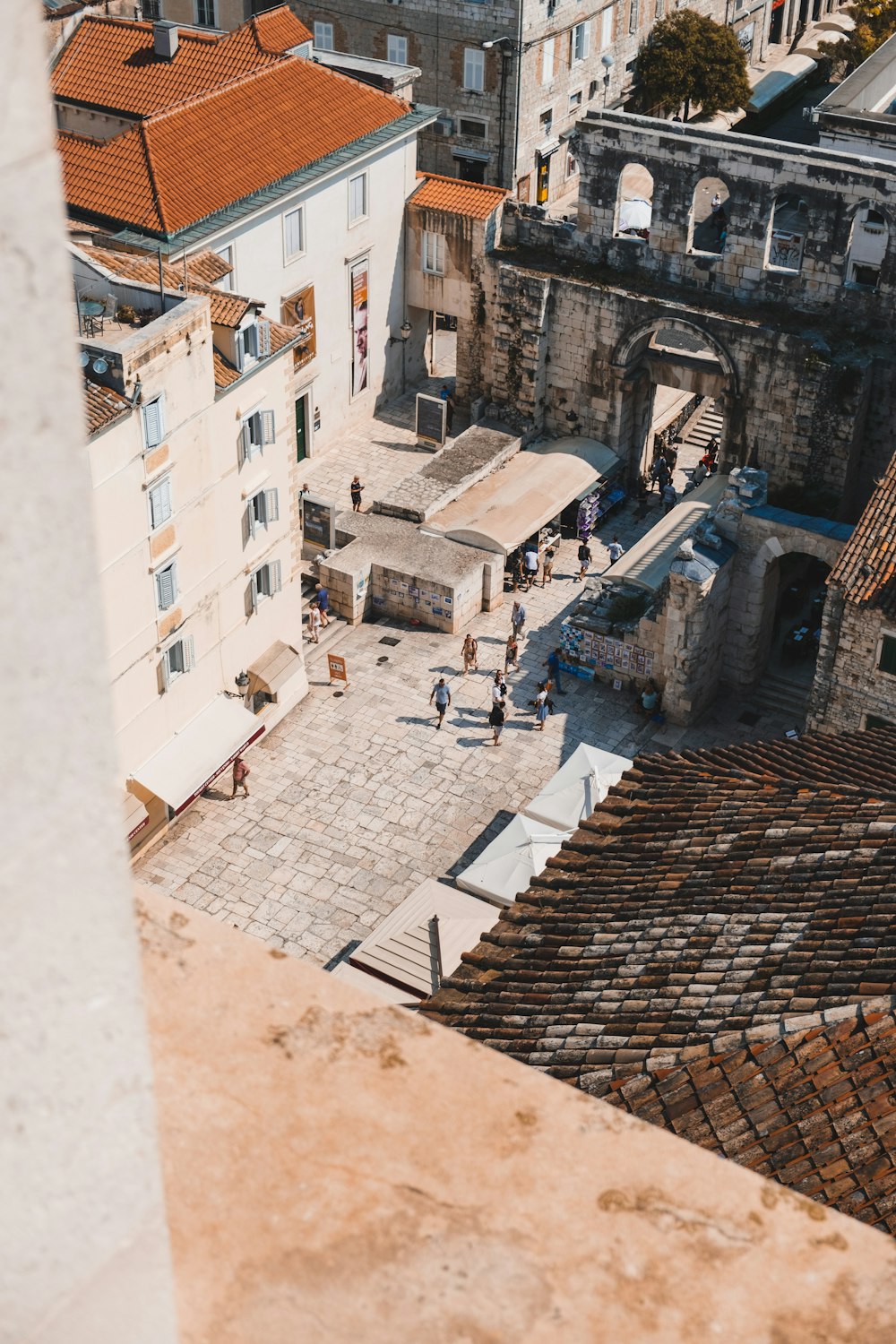 a group of people standing on top of a roof