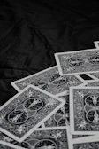 A stack of vintage military-themed card games with detailed illustrations