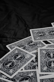 A vibrant trading card game deck fanned out on a dark surface.