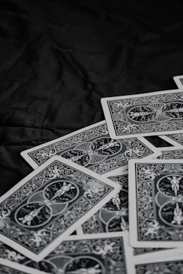 A stack of vintage military-themed card games with detailed illustrations
