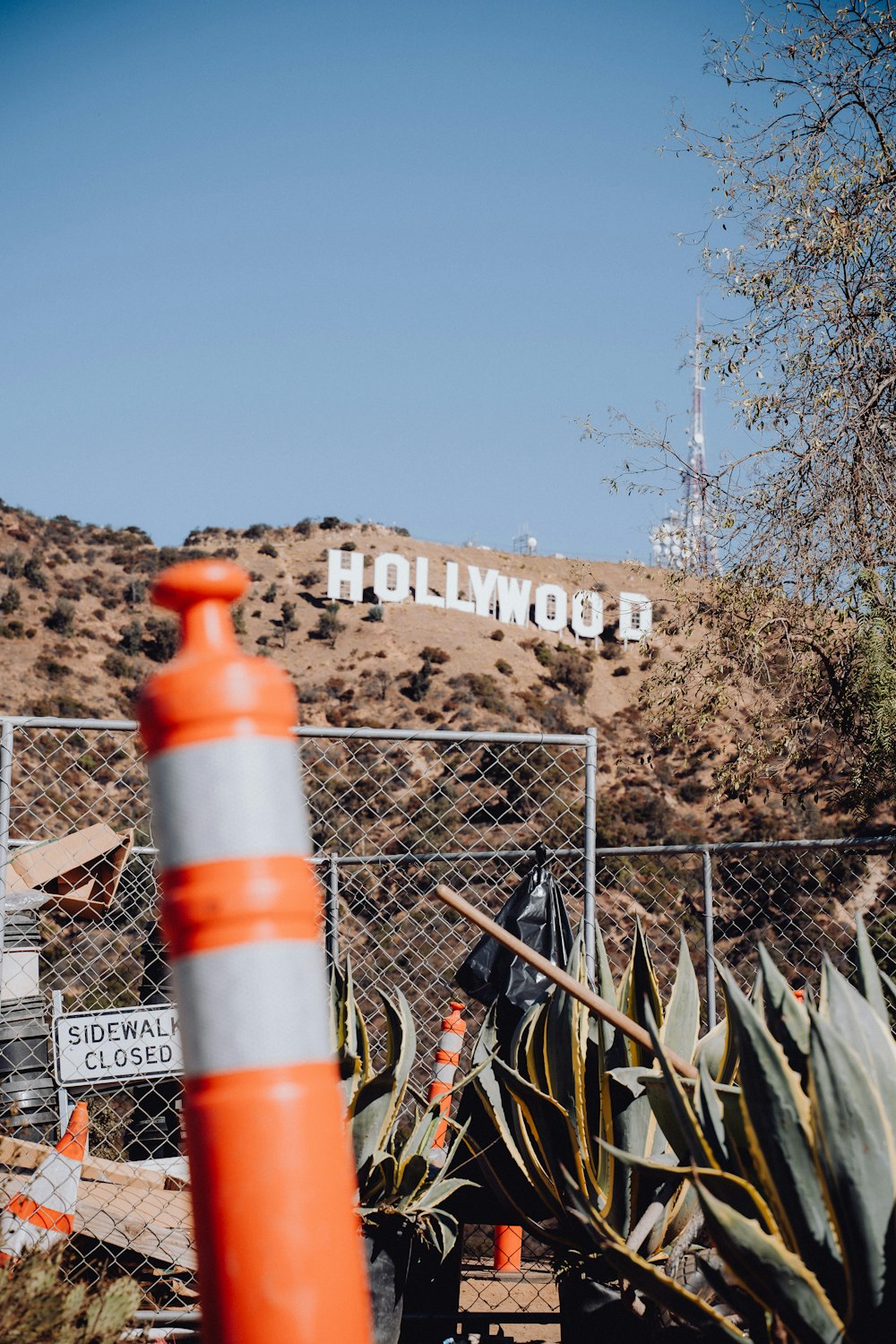 a fence with a sign on top of it