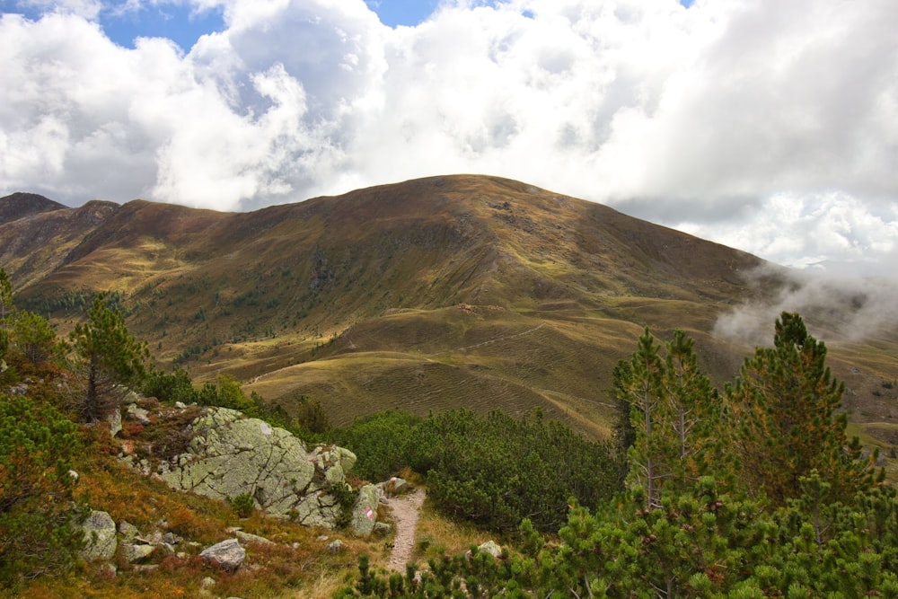 a view of a mountain range with clouds in the sky