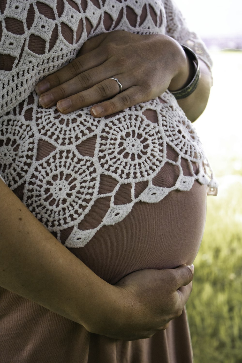 a pregnant woman is holding her belly