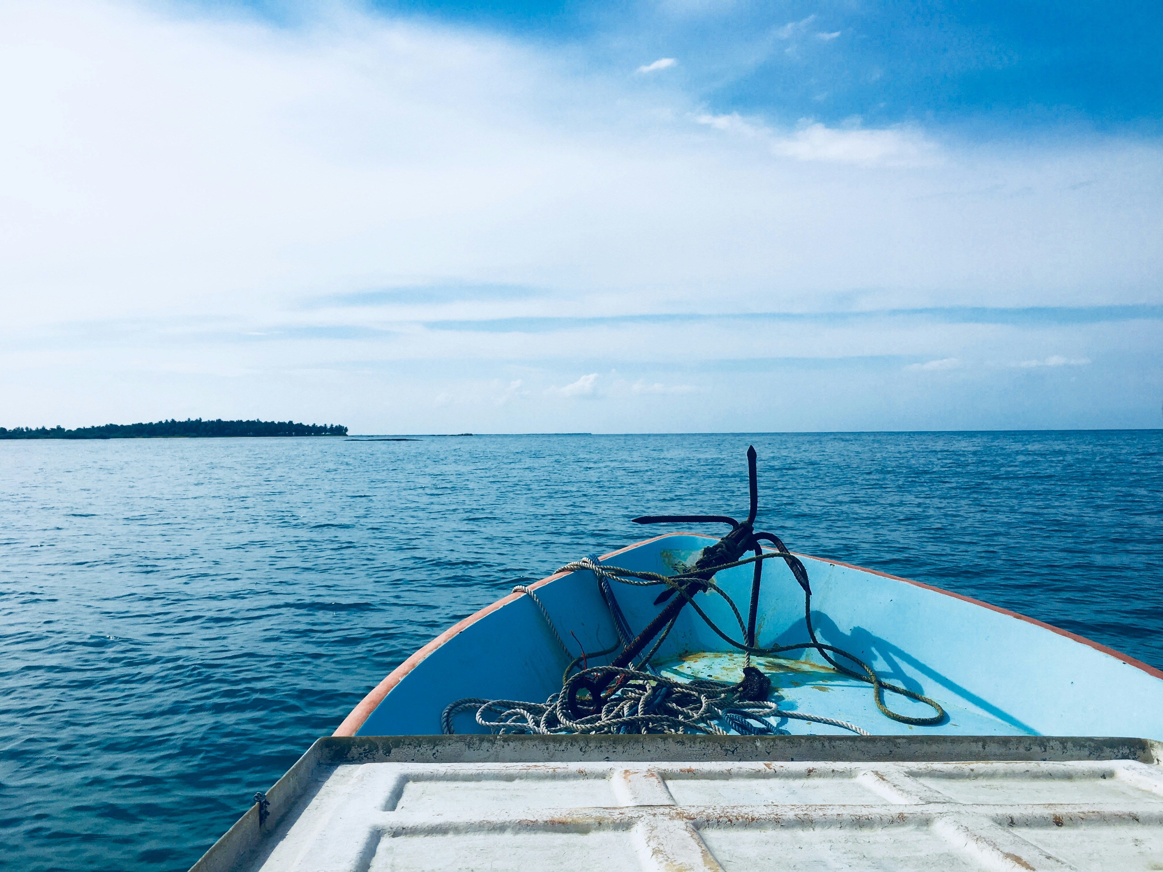 a boat with a rope on the front of it in the water